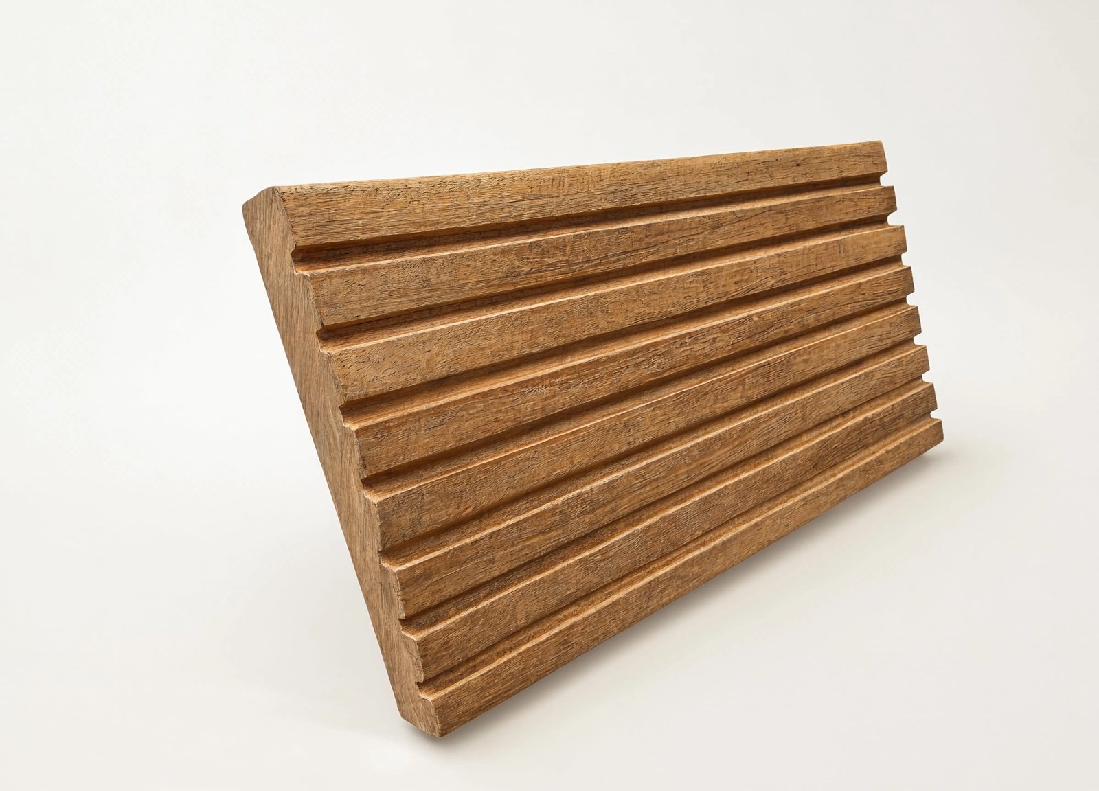 Wide cladding board with a ridged, faceted face